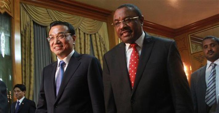 Chinese Premier Li Keqiang, left, is welcomed by Ethiopian Premier Hailemariam Desalegn at the Ethiopian Presidential Palace, in Addis Ababa, Ethiopia, Sunday May 4, 2014. Chinese Premier Li Keqiang has started his four-country tour of Africa with calls for deepening of ties between China and Africa. Li arrived in the Ethiopian capital of Addis Ababa Sunday and met with Ethiopian Premier Hailemariam Desalegn and signed a raft of trade agreements. ELIAS ASMARE — AP Photo
